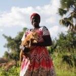 Zainab Aliru poses for a photograph with lamb