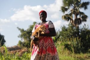 Zainab Aliru poses for a photograph with lamb